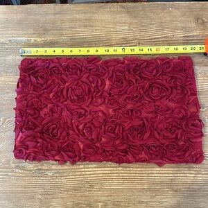 Red pillow case with embellishments of rose flowers zipper
